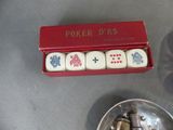 four dice pieces in a red box on a table