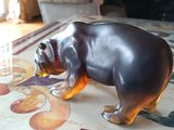 a figurine of a bear that is on a table