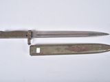 a knife that is laying on a table