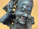 a statue of a man with a hat on his head