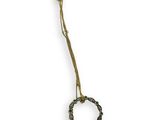 brass plated necklace with green and black beads on a white background