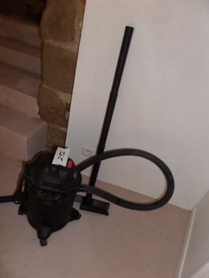 a vacuum that is sitting on the floor next to the stairs