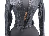 an image of a mannequin wearing a black dress and jacket