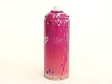 a pink spray can with a white cap on a white surface