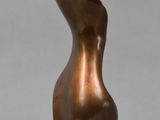 bronze sculpture of a woman ' s torso on a marble base
