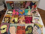 a lot of comic books on a white table