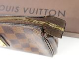 a louis vuitton purse sitting on a table