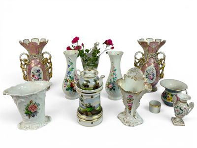 many vases that are sitting on a white surface