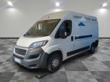 the white van is parked in the empty room of the building