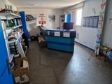 an image of a garage with a lot of items on the shelves