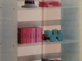 a picture of a book shelf with toy cars on it