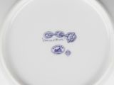 a white plate with a blue and white design on it