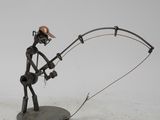 sculpture of a man with a fishing rod on a white surface