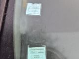 a sticker on the windshield of a car that has a sticker on it