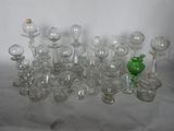 a lot of glass vases that are sitting on a table