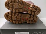a close up of a pair of shoes on top of a box