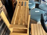 two wooden chairs and a table in a room