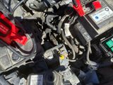 a close up of a car ' s engine with its hood open