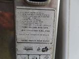 a close up of a parking meter with a sign on it