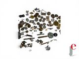 a lot of different types of screws and screws on a white surface