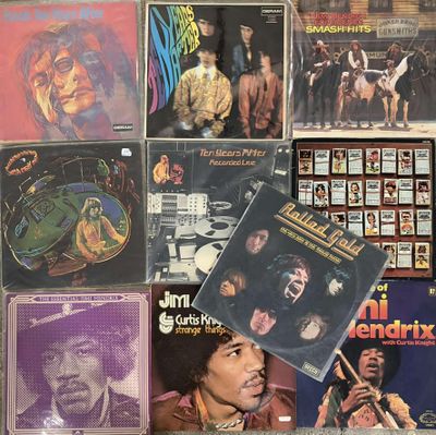 a lot of records on the wall of a room