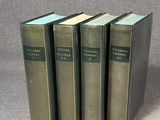 three books sitting on top of each other on a table