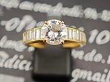 une bague en or sertie d'un diamant et de diamants taille baguette