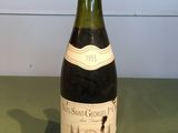 a bottle of wine that is sitting on a table