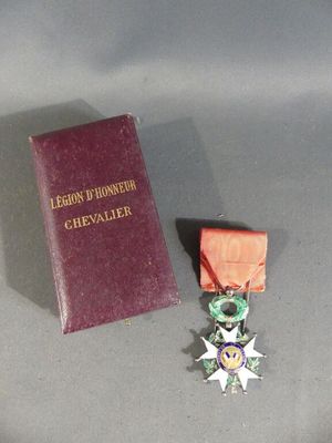 a medal and a book sitting on a table