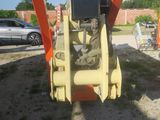 an image of a construction vehicle parked on the side of the road