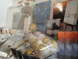 a display case filled with lots of different types of cakes