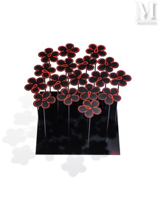 a vase with a bunch of red flowers in it
