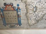 a picture of a map of africa with a coat of arms on it