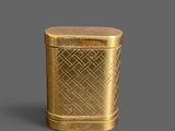 3docl of a gold canister with a diamond pattern on the lid