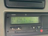 a car dashboard with a digital clock on it