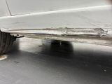 a close up of a car ' s rear end with a flat tire