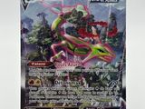 a close up of a pokemon card on a white surface