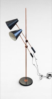 two lamps on a stand with a cord connected to them