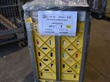 a cart with a sign on it sitting in a warehouse