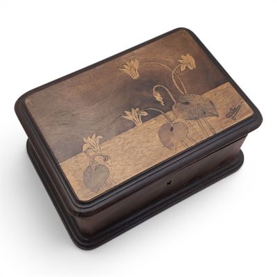an image of a wooden box with a painting on it