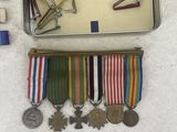 a metal box with a bunch of medals on it