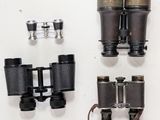 a lot of different types of binoculars that are on the table