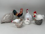 five different types of ceramic figurines sitting on a table