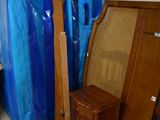 several pieces of furniture are wrapped in plastic and stacked on top of each other