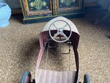 a small toy car that is sitting on the floor