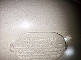 a close up of a frying pan on a wooden table