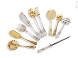 many different types of silverware on a white surface