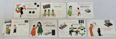 several books are lined up on a white table cloth
