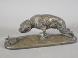 bronze statue of a dog and a duck on a stone base