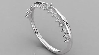 a white gold ring with diamonds on a gray background